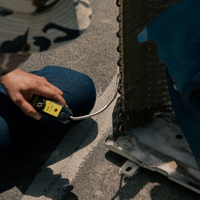 Technician Fixing an Aircon